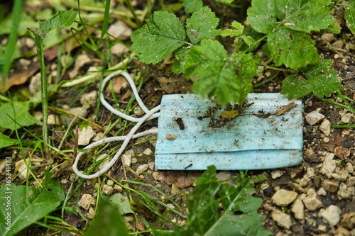 close-up view of dirty medical mask on ground outdoors