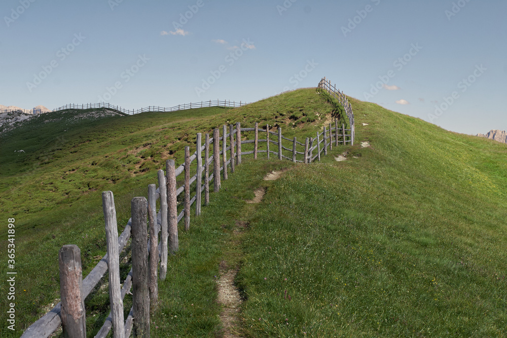 Mountain trail with wooden fence, Val di Funes