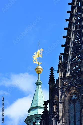 Weather vane in the form of a golden left. Prague