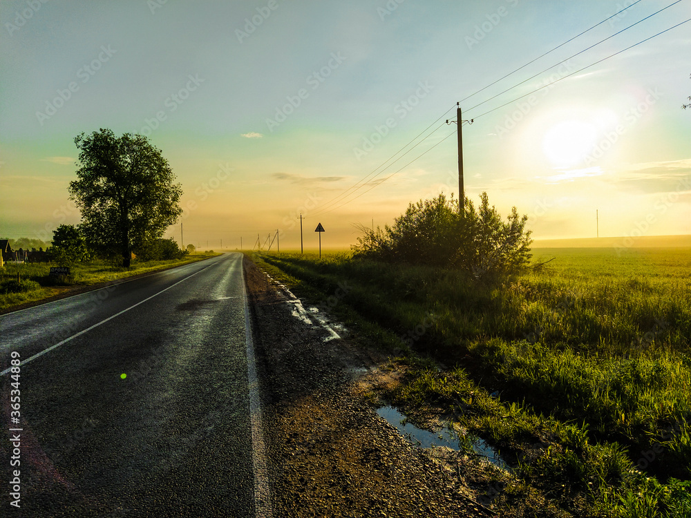 image of a country highway at sunset