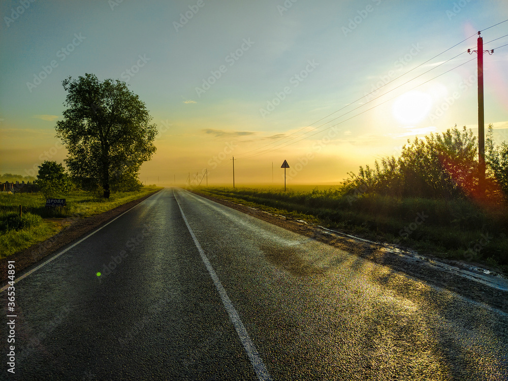 image of a country highway at sunset