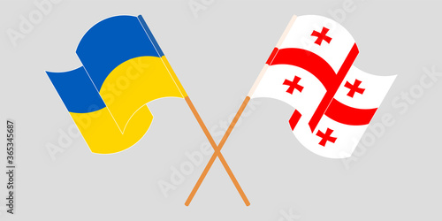 Crossed and waving flags of Georgia and the Ukraine