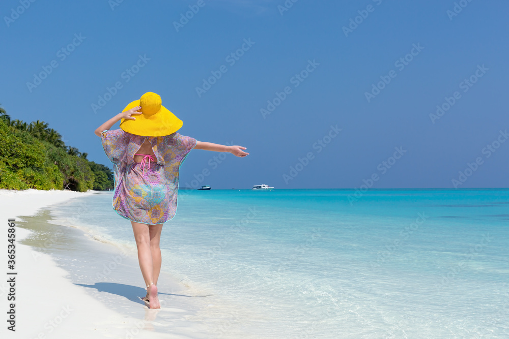 appy woman in summer hat walking on beautiful beach, travel card appy woman in summer hat walking on beautiful beach, travel card