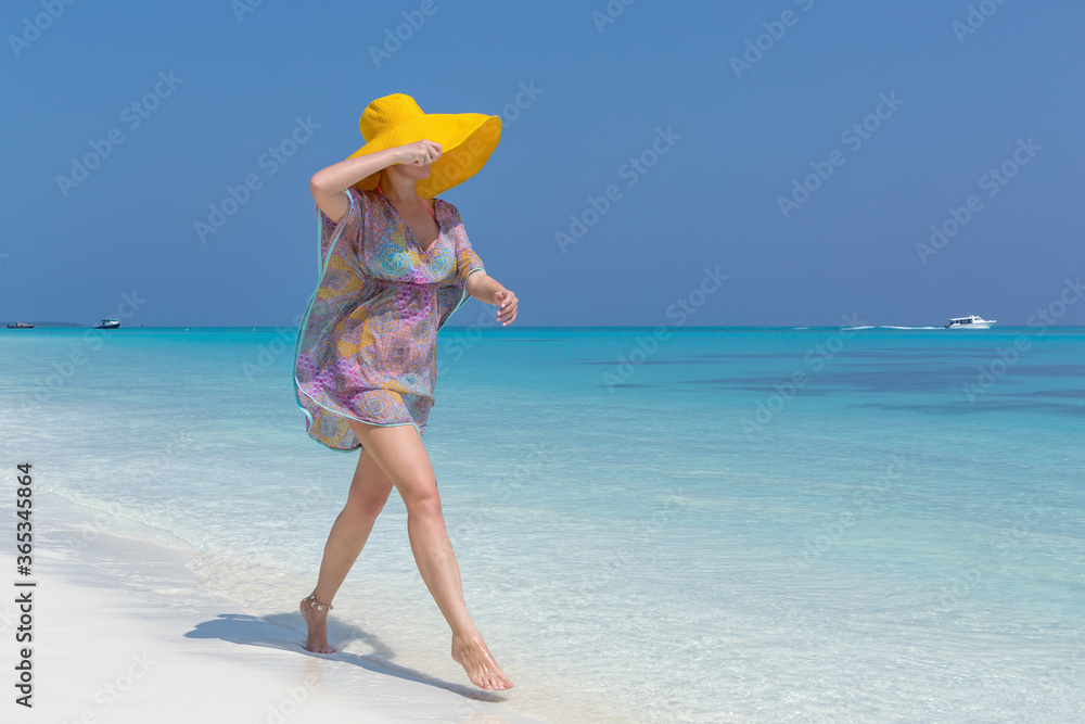 appy woman in summer hat walking on beautiful beach, travel card appy woman in summer hat walking on beautiful beach, travel card