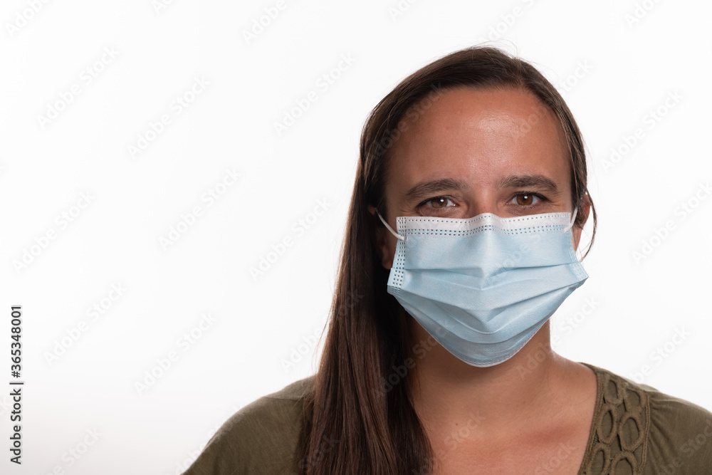 Headshot of female student wearing Covid 19 mask isolated on white background with room for copy to the left Headshot of female student wearing Covid 19 mask isolated on white background with room for copy to the left