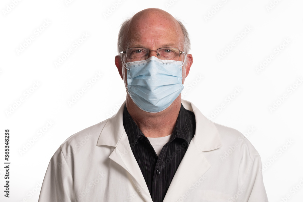 Portrait of male university professor wearing Covid 19 mask and lab coat isolated on white background