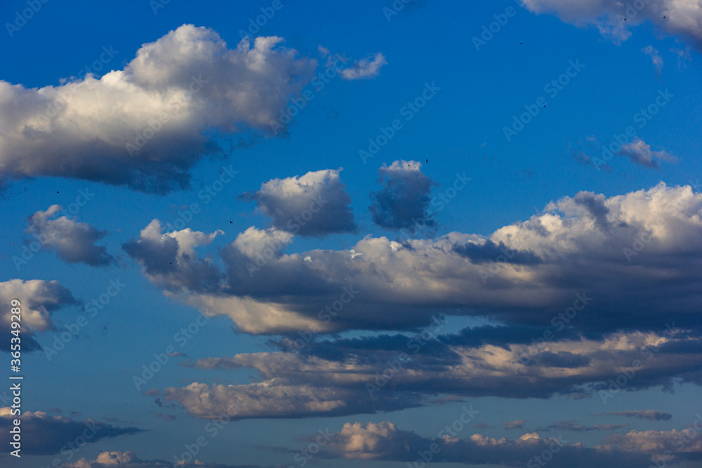 Blue sky with white and gray clouds