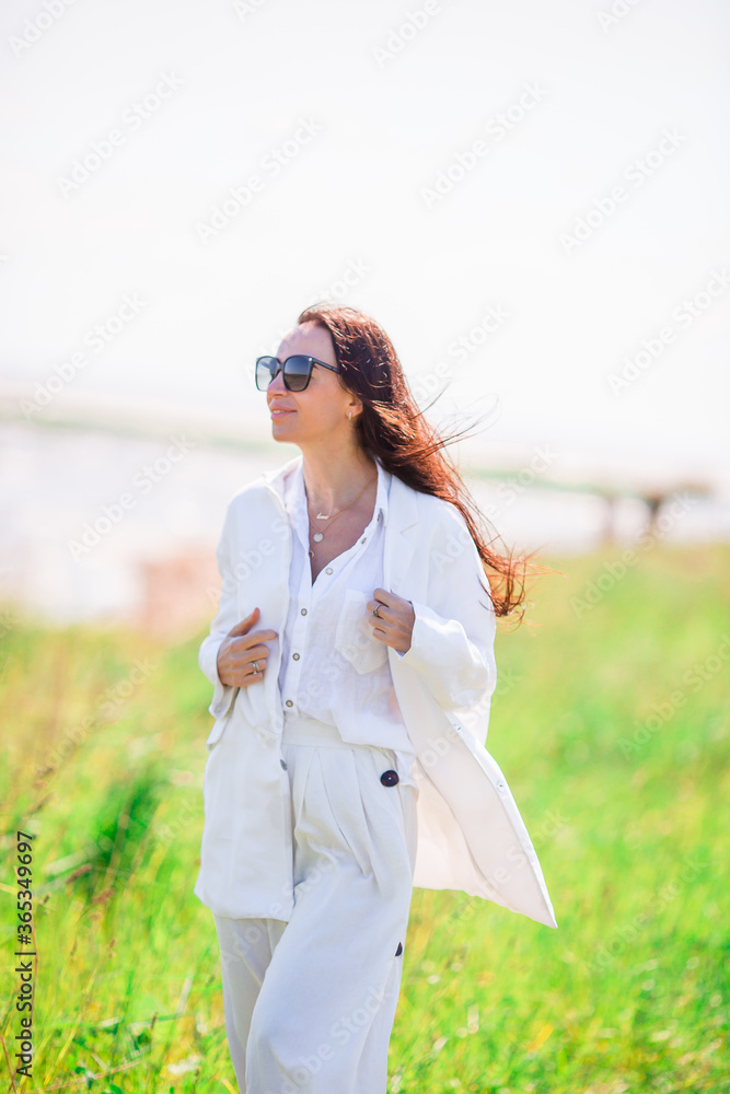 Adorable woman at beach during summer vacation Adorable woman at beach during summer vacation