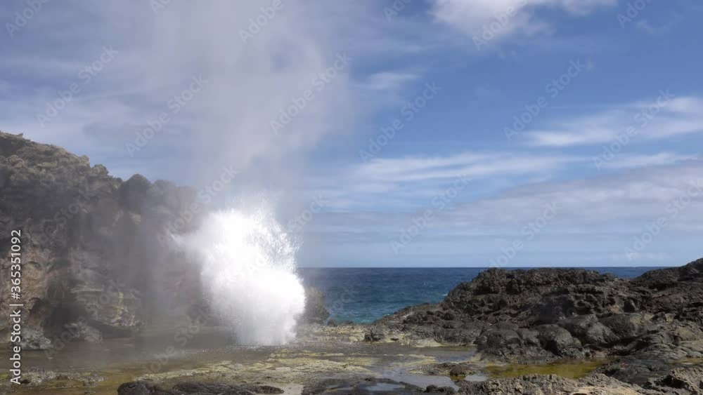 Water Spewing Up from blowhole in Rock near Coast at Maui, Hawaii, Medium Water Spewing Up from blowhole in Rock near Coast at Maui, Hawaii, Medium