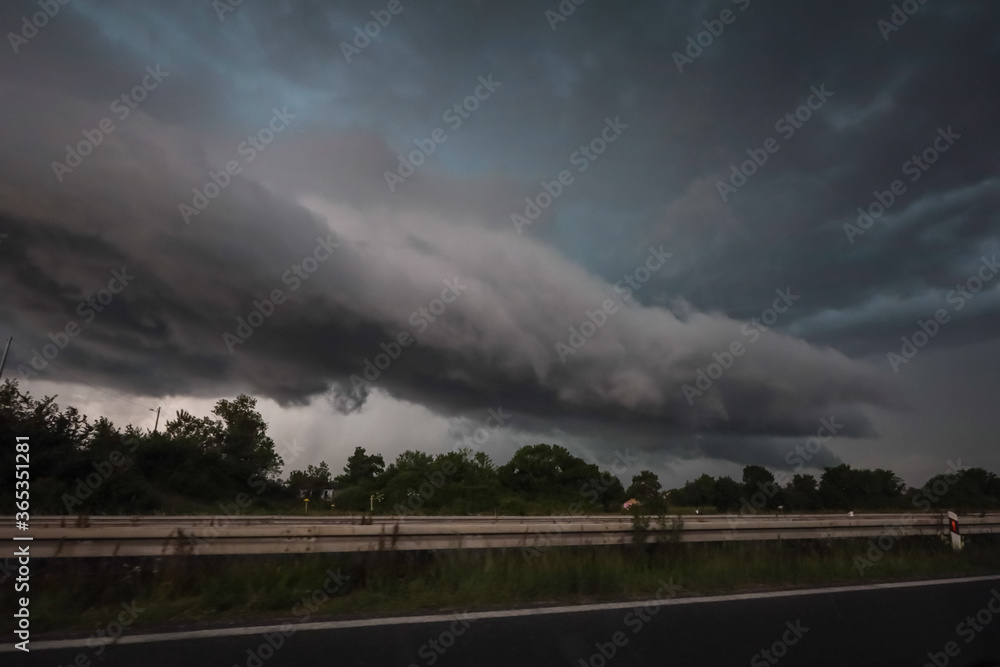 Black storm clouds above highway