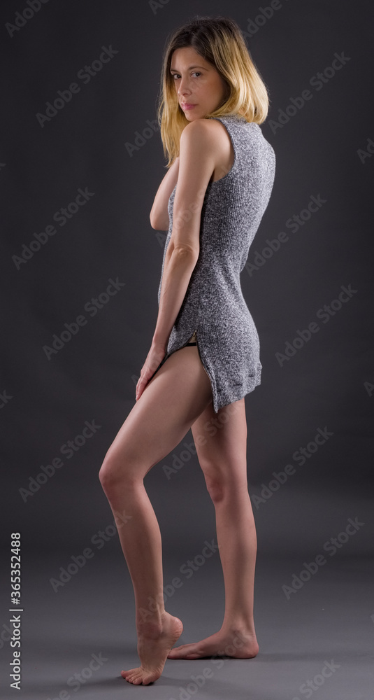 Standing Woman in Gray Mini Dress