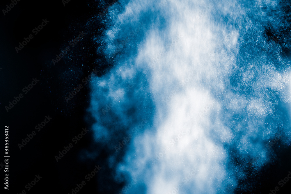 Powerful and furious jet of water on black background. Abstract background concept.