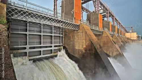 Discharge water from the dam of hydroelectric plant photo