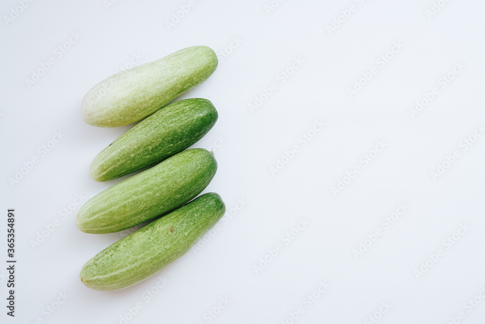 fresh green cucumbers with a background isolated white background with copyspace fresh green cucumbers with a background isolated white background with copyspace
