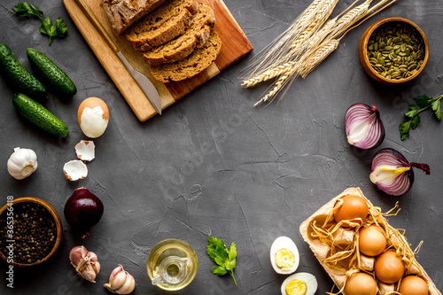 Above view of country dinner table with effs, bread, potatoes