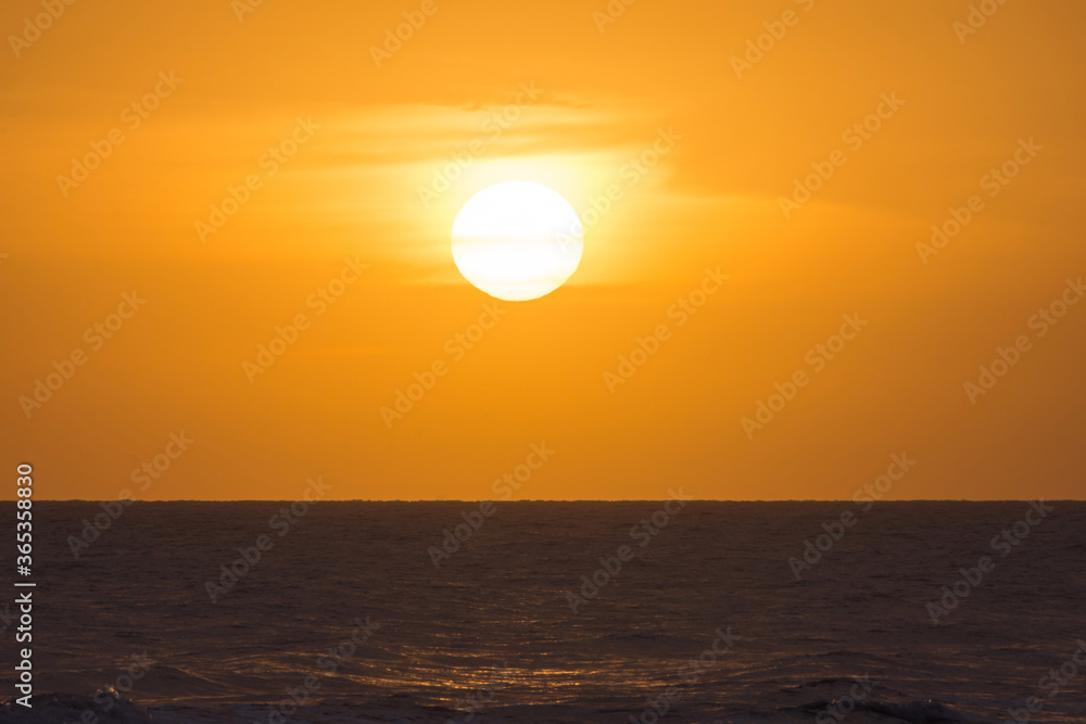Orange sky at sunset over the sea