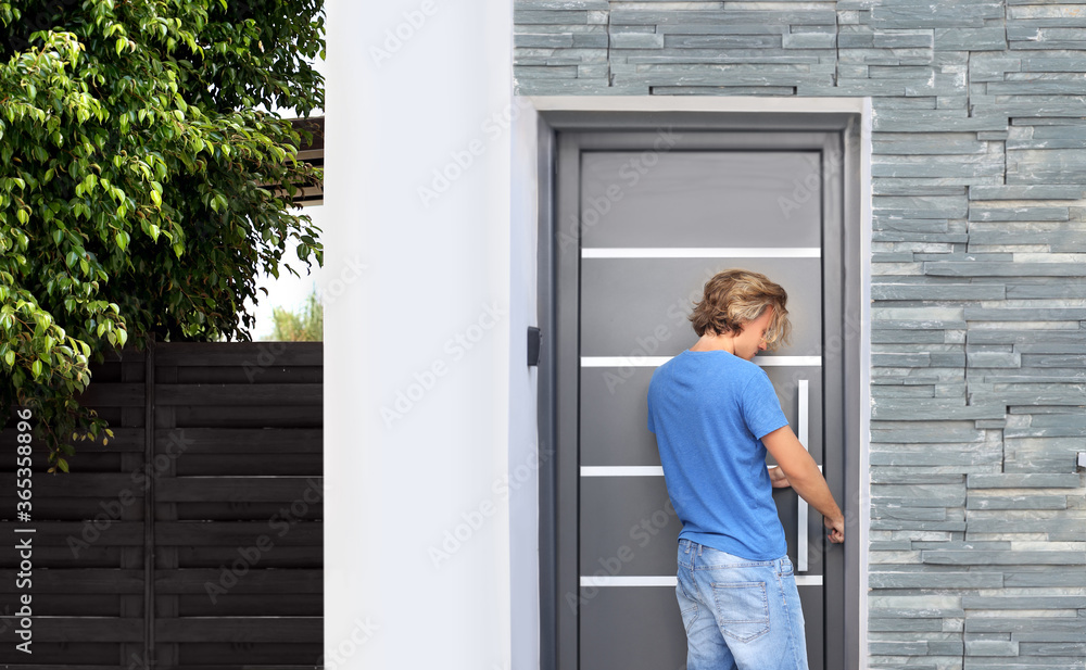 Man opening the door of her home.Inviting the guests Man opening the door of her home.Inviting the guests