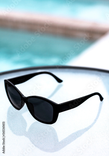 sunglasses by pool