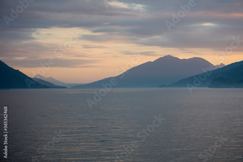 A serene dusk settles over the island of Alor in Indonesia. This tropical area harbors extraordinary marine biodiversity and is a part of the Ring of Fire.