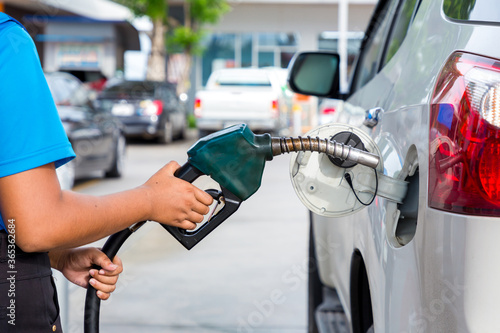 Hand Man Refill and filling Oil Gas Fuel at station. Gas station - refueling.To fill the machine with fuel. Car fill with gasoline at a gas station. Gas station pump. 