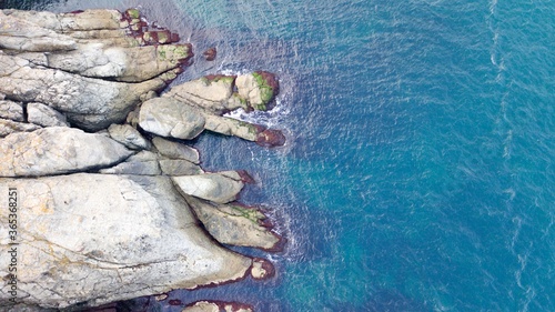 Aerial view of Cliffs and colorful landscape near the sea. reefs reminiscent of the continents of the world.