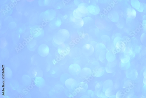 Light blue bokeh background. Abstract defocused backdrop with circles.