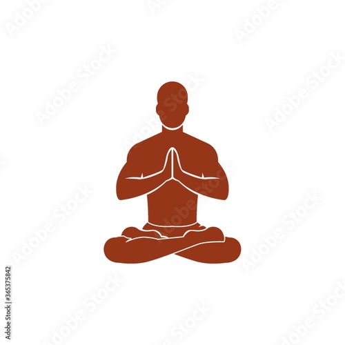 man practicing yoga in lotus pose