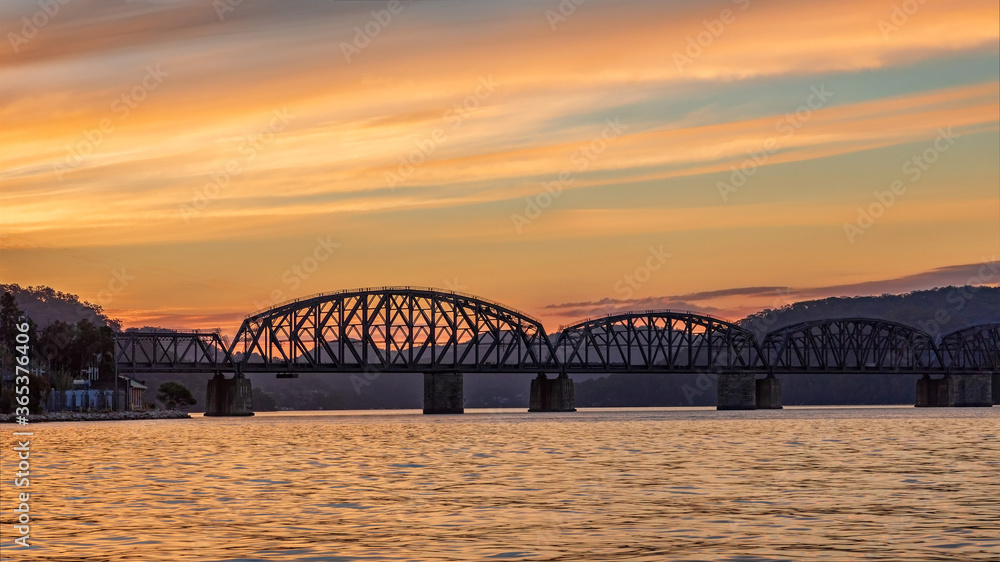 Sunset at the heritage-listed Hawkesbury River Railway Bridge, Brooklyn, NSW, Australia