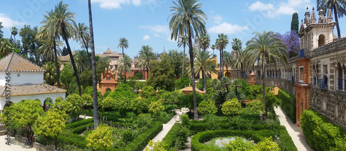 Lush manicured gardens of the Alcazar Moorish castle in Spain photo