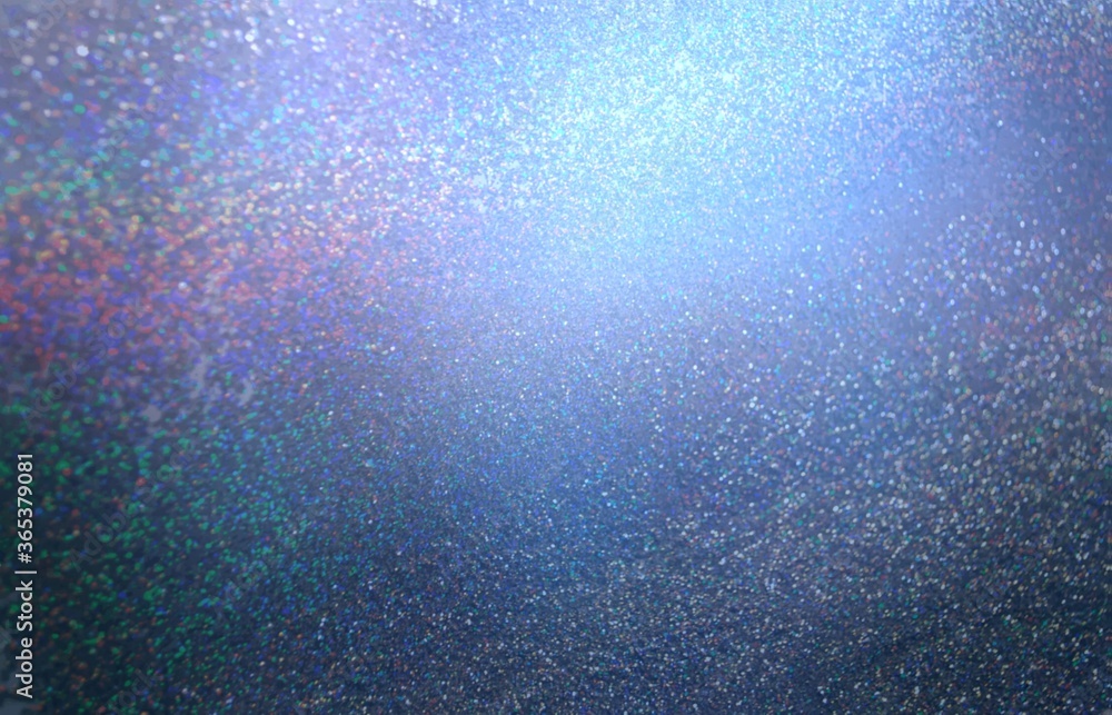 Glitter hologram on dark blue abstract background. Sparkles glitz texture. 