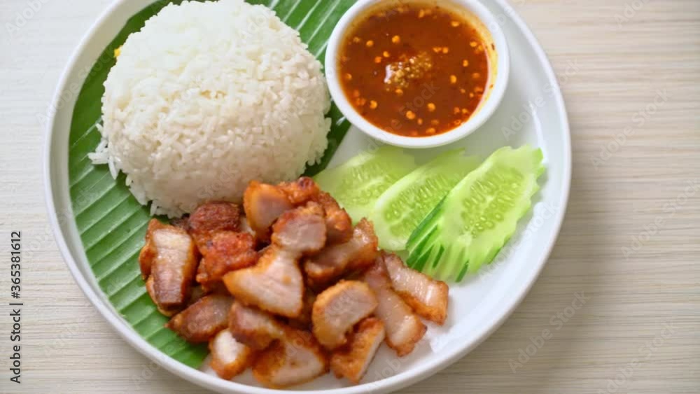 fried belly pork with rice with spicy sauce in Asian style fried belly pork with rice with spicy sauce in Asian style