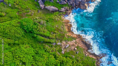 Amazing aerial view of Grand Anse in La Digue Island, Seychelles. Ocean and forest
