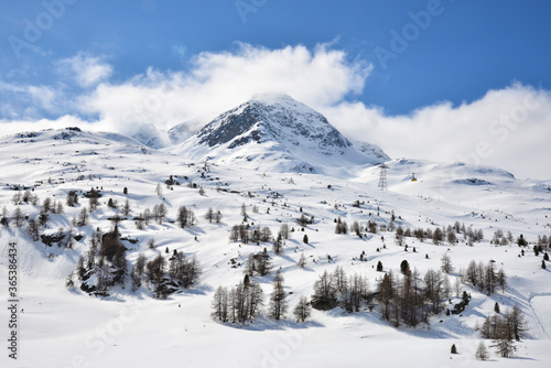 View of snow mountain along Bernina Express train near Ospizio Bernina, Switzerland