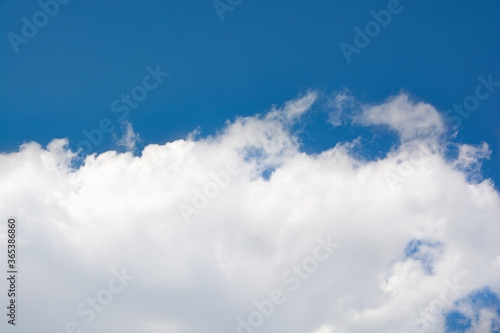 Canvas Print Snow-white clouds against a blue sky
