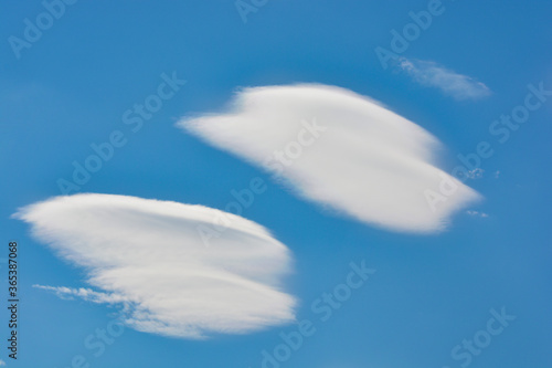 Snow-white clouds against a blue sky