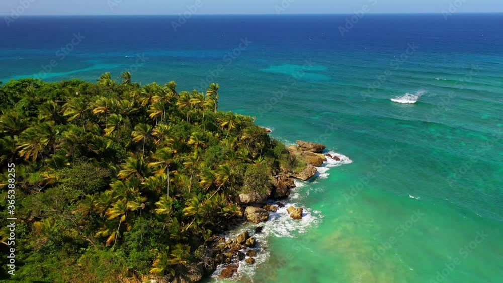 Scenic flight off the coast of nagua Dominican Republic, where we see the blue water and the coconut trees on a bright warm day Scenic flight off the coast of nagua Dominican Republic, where we see the blue water and the coconut trees on a bright warm day