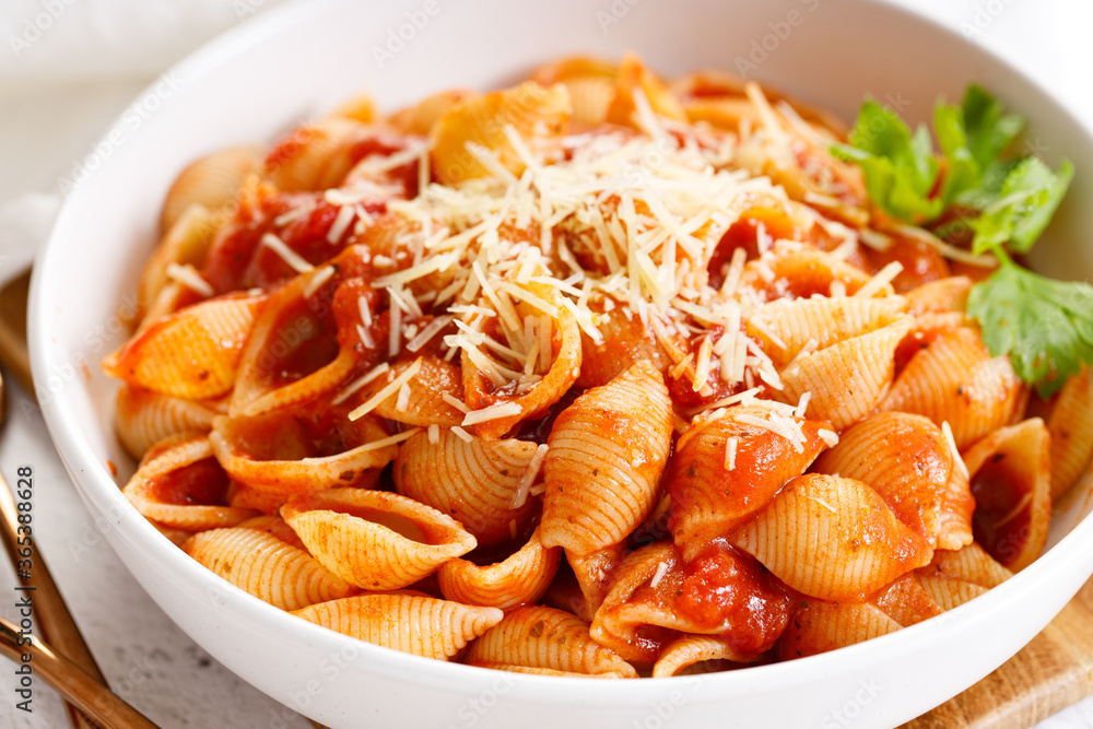Pasta conchiglie with tomato sauce and parmesan cheese Pasta conchiglie with tomato sauce and parmesan cheese