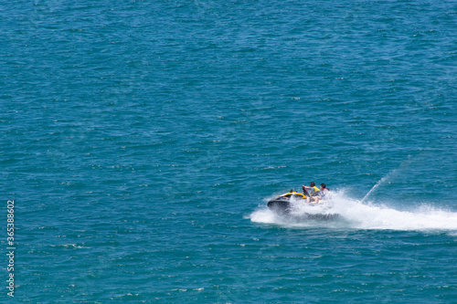 Males Riding Jet-ski at Sea
