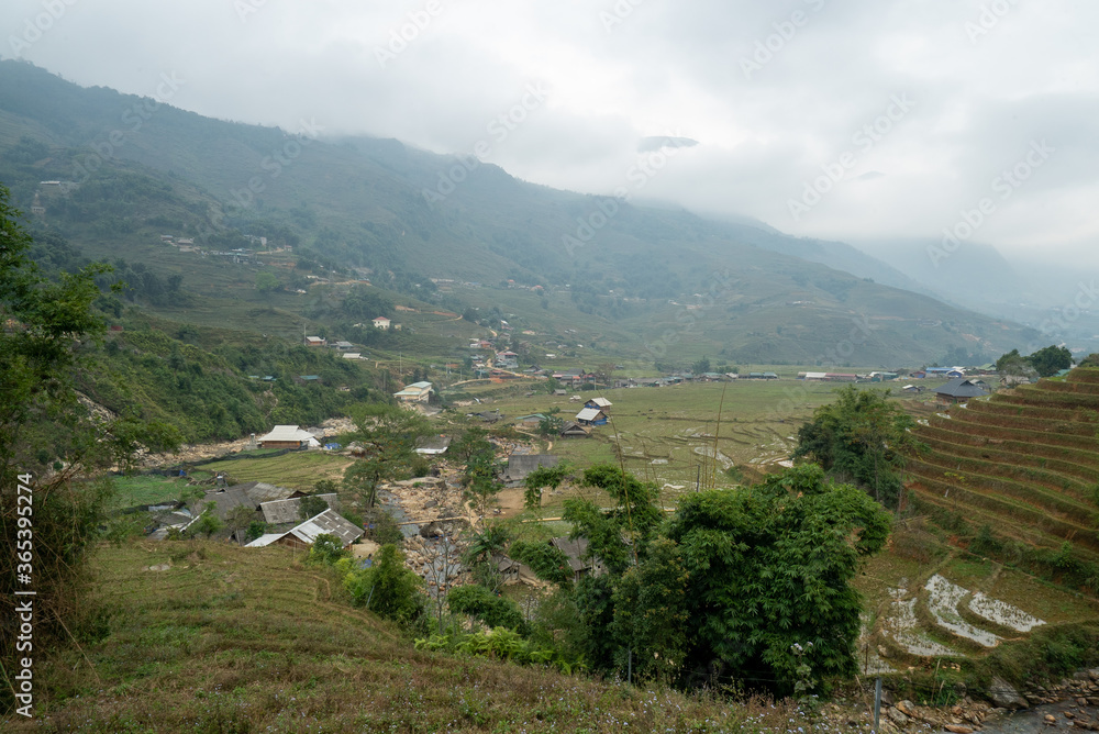 Houses in Mường Hoa Valley with cloud near Sapa in Vietnam Houses in Mường Hoa Valley with cloud near Sapa in Vietnam