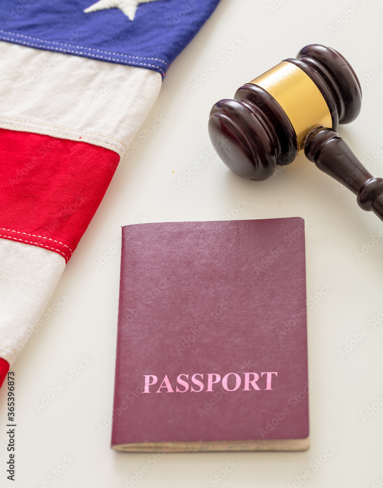 Passport, law gavel and USA flag on white background, close up view.