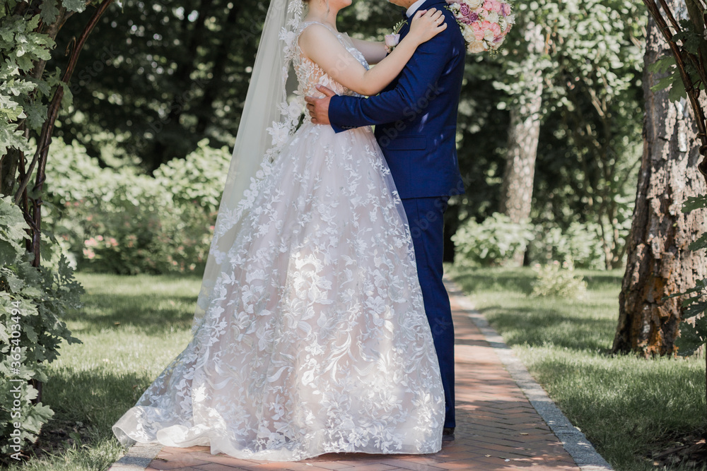groom with bride together in summer park groom with bride together in summer park