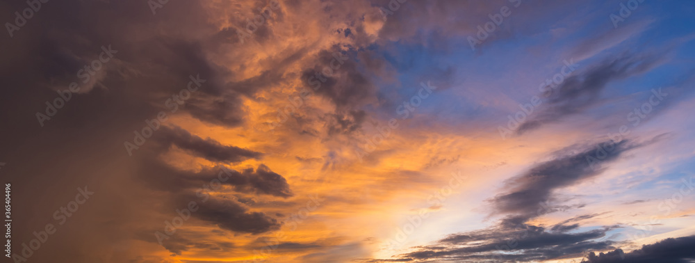 Panorama view of dramatic beautiful nature sunset sky and clouds background Panorama view of dramatic beautiful nature sunset sky and clouds background