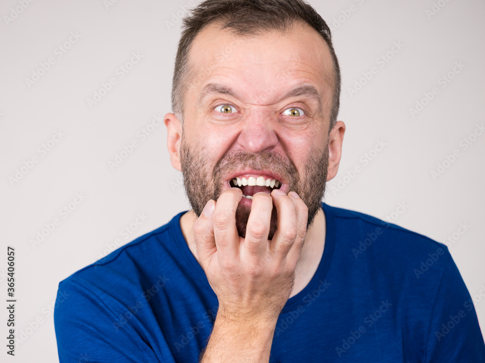 Man biting his nails