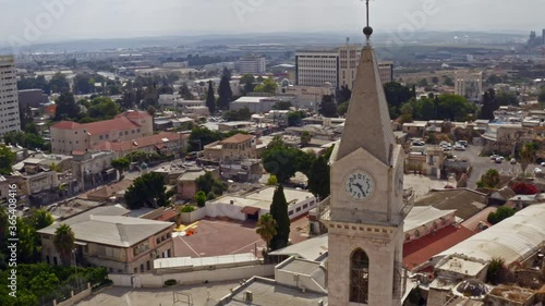 Big Franciscan church in the city center of Ramleh, Israel, aerial drone view 4k photo