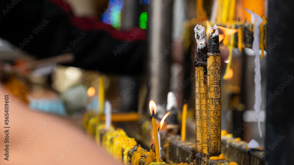 Large candles lit for blessing on Buddha's day and fortifying fortune