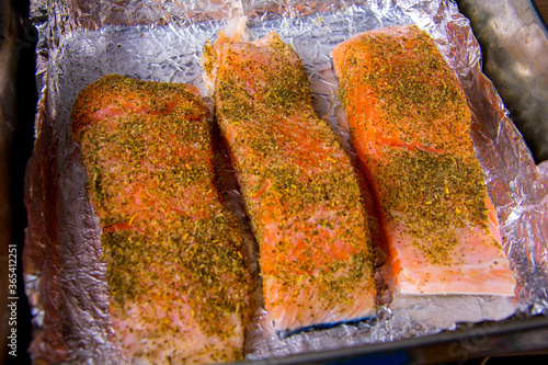 Pickled pieces of raw salmon with spices.
