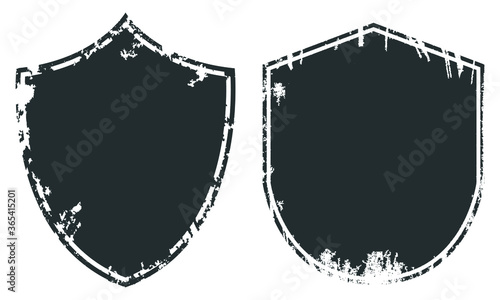 Set of grunge textured black labels.