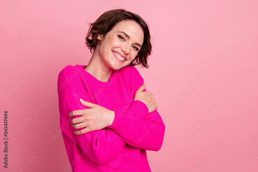 Photo of overjoyed charming lady touch hands hug herself shoulders joyful soft cloth laundry warmth toothy smiling wear casual bright sweater isolated pink pastel color background Photo of overjoyed charming lady touch hands hug herself shoulders joyful soft cloth laundry warmth toothy smiling wear casual bright sweater isolated pink pastel color background