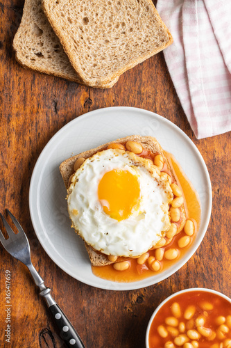 Toast with fried egg and baked beans.