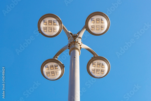 LED lighting pole new technoly of lighting system with blue sky on outdoor street walkway. photo
